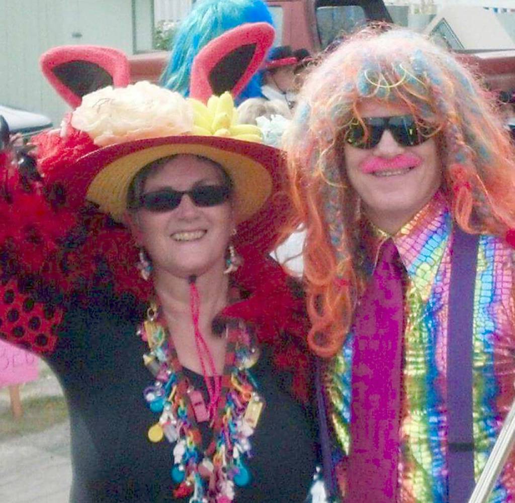 Rindie Red Lady and Brian Rainbow Mills are members of the Sauerkraut Band​. He plays trombone. She ​dresses crazy and blows a whistle. (Contributed photo)