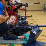 Sydney McKay listens as Shelby Huber gives her tips to improve her shooting during the CMP Air Rifle Marksmanship Camp at Snohomish High School on Thursday. (Olivia Vanni / The Herald)
