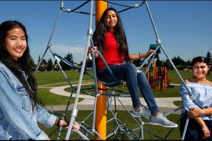 From left, Kayleen Yonn, 15, Brittany Mendez-Hernandez, 14, and Careana Willis, 15, meet at Walter E. Hall Park where on Saturday theyll help with Mobile Dental Day. Its a project of Leadership Launch. (Dan Bates / The Herald)