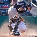 Aquasoxs Connor Kopach is safe at home with the Volcanos Joey Bart covering Sunday afternoon at Everett Memorial Stadium on July 15, 2018. (Kevin Clark / The Herald)