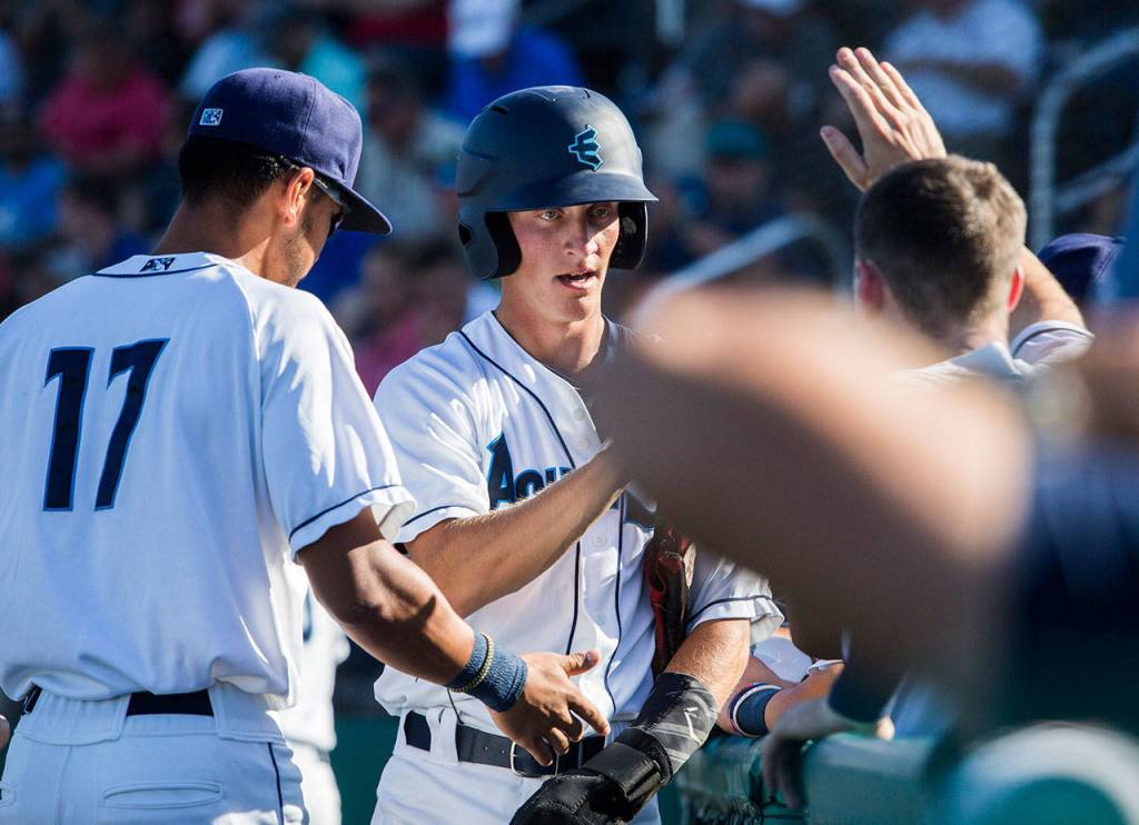 Aquasoxs Connor Kopach highfives his teammates after scoring during the game at Everett Memorial Stadium on Sunday, July 15, 2018 in Everett, Wa. (Olivia Vanni / The Herald)