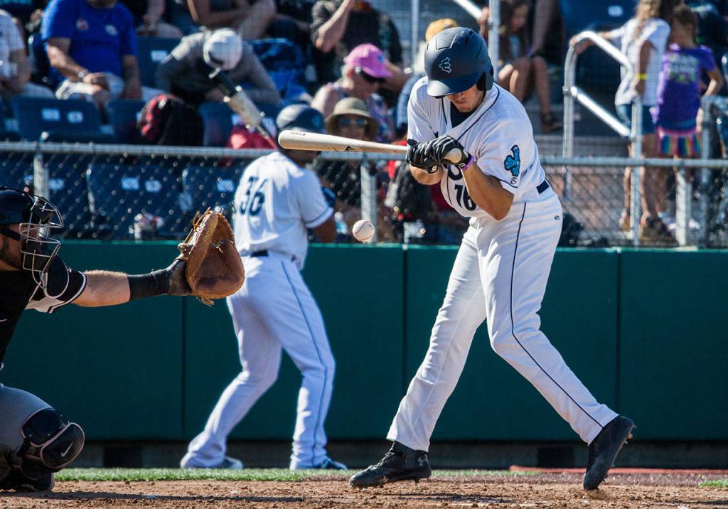 Aquasoxs Ryne Ogren flinches after being hit with a pitch during the game at Everett Memorial Stadium on Sunday, July 15, 2018 in Everett, Wa. (Olivia Vanni / The Herald)