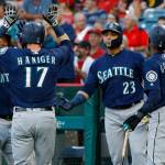 Seattles Mitch Haniger (17) gets congratulations from Jean Segura (left), Nelson Cruz (23), and Dee Gordon (9) after hitting a three-run home run against the Los Angeles Angels during a game on July 10 in Anaheim, California. (AP Photo/Alex Gallardo)