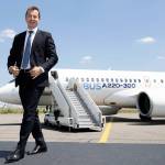 Guillaume Faury, chief executive officer of commercial aircraft at Airbus, strides alongside the new Airbus A220 single-aisle plane  formerly the Bombardier CSeries  in Toulouse, France, on July 10. (Christophe Morin / Bloomberg News)