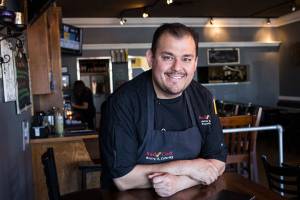 Former Sno-Isle Tech culinary student Adrian Ramirez at Red Cork Bistro on Monday, July 16, 2018 in Mukilteo, Wa. Ramirez co-owns Red Cork Bistro with his wife, Soco Molina. (Andy Bronson / The Herald)