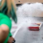 Campers duel during a fire hose game during Kids Fire Camp at South County Fire Administrative Headquarters on Wednesday in Everett. (Olivia Vanni / The Herald)
