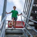Alex Bonhan, 13, runs down the stairs of a training tower at the obsitcal course station during Kids Fire Camp at South County Fire Administrative Headquarters on Wednesday in Everett. (Olivia Vanni / The Herald)