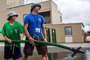 South County firefighter Phil Pons looks up after his team loses at a fire house game during Kids Fire Camp at South County Fire Administrative Headquarters on Wednesday, July 18, 2018 in Everett, Wa. (Olivia Vanni / The Herald)