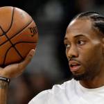 In this Jan. 5, 2018, file photo, San Antonio Spurs forward Kawhi Leonard handles a ball before an NBA game against the Phoenix Suns in San Antonio. (AP Photo/Eric Gay, File)