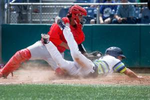 The Aquasoxs Connor Hoover is tagged out at home plate by Spokanes Francisco Ventura as the Everett Aquasox lost to the Spokane Indians 7-3 at Everett Memorial Stadium on Wednesday, July 18, 2018 in Everett, Wa. (Andy Bronson / The Herald)