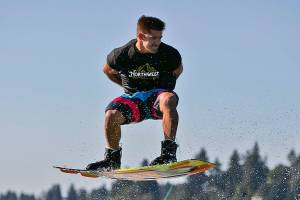 Everett native Chad Douglas rides his wakeboard on Lake Washington. (Photo by Rob Adams)