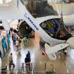 An experimental Boeing plane hangs visitors looking at engines and planes on display at the Future of Flight on Friday, July 20, 2018 in Mukilteo, Wa. The Boeing Co., plans this year to operate the Future of Flight Aviation Center. (Andy Bronson / The Herald)