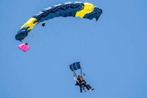 Stu Williamson, 100, and tandem instructor Vladimir Ursachii prepare for landing during Williamsons birthday skydive at Skydive Snohomish on Sunday, July 22, 2018 in Snohomish, Wa. (Olivia Vanni / The Herald)