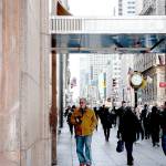 Pedestrians pass in front of the Tiffany Co. flagship store on Fifth Avenue in New York. ( Bloomberg/Sarah Blesener)