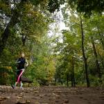 A jogger is seen along a trail in Leavenworths Waterfront Park. The park hugs the winding Wenatchee River nearby and offers views of nearby mountains. (Photo by Ian Terry)