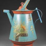 Turquoise blue with gold trim and a bird finial was used to decorate this 19th-century watering can. It sold for $214. (Cowles Syndicate Inc.)