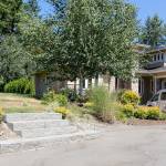 Steps leading to an empty lot are the remains of arson 10 years ago. (Kevin Clark / The Herald)