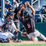 Aquasoxs Geoandry Montilla tags out Volcanoes David Villar at Everett Memorial Stadium on July 15. (Olivia Vanni / The Herald)