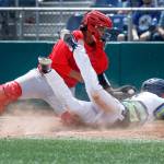 The Aquasoxs Connor Hoover is tagged out at home plate by Spokanes Francisco Ventura as the Aquasox lost to the Indians 7-3 at Everett Memorial Stadium on July 18. (Andy Bronson / The Herald)