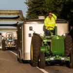 Jeff Newell blocks the early morning sun from his eyes as he cruises down Highway 530, at a easy 16 miles per hour, on his John Deere tractor on July 11 in Arlington. Ron Wachholtz follows behind as the two raise money for the American Diabetes Association while <a href="https://www.heraldnet.com/news/slow-ride-from-arlington-to-alaska-on-a-john-deere-tractor/" target="_blank">driving their tractors to Prudhoe </a><a href="https://www.heraldnet.com/news/slow-ride-from-arlington-to-alaska-on-a-john-deere-tractor/" target="_blank">Bay</a>, Alaska. (Andy Bronson / The Herald)