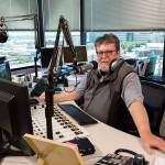 Tom Lafferty is seen in the booth at <a href="https://www.heraldnet.com/sports/everett-based-radio-station-ends-sports-only-format/" target="_blank">KRKO</a> on July 12 in Everett. (Andy Bronson / The Herald)