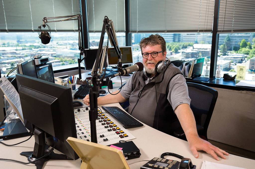 Tom Lafferty is seen in the booth at <a href="https://www.heraldnet.com/sports/everett-based-radio-station-ends-sports-only-format/" target="_blank">KRKO</a> on July 12 in Everett. (Andy Bronson / The Herald)