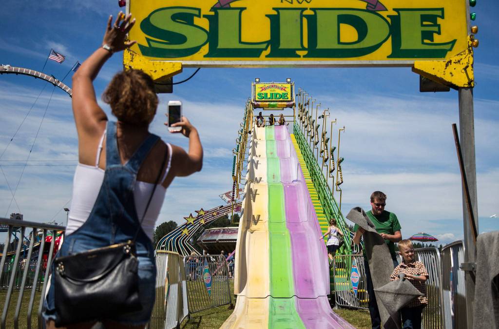 Erika Wells waves at her son before he goes down the side during Kla Ha Ya Days on Saturday, July 21, 2018 in Snohomish, Wa. (Olivia Vanni / The Herald)