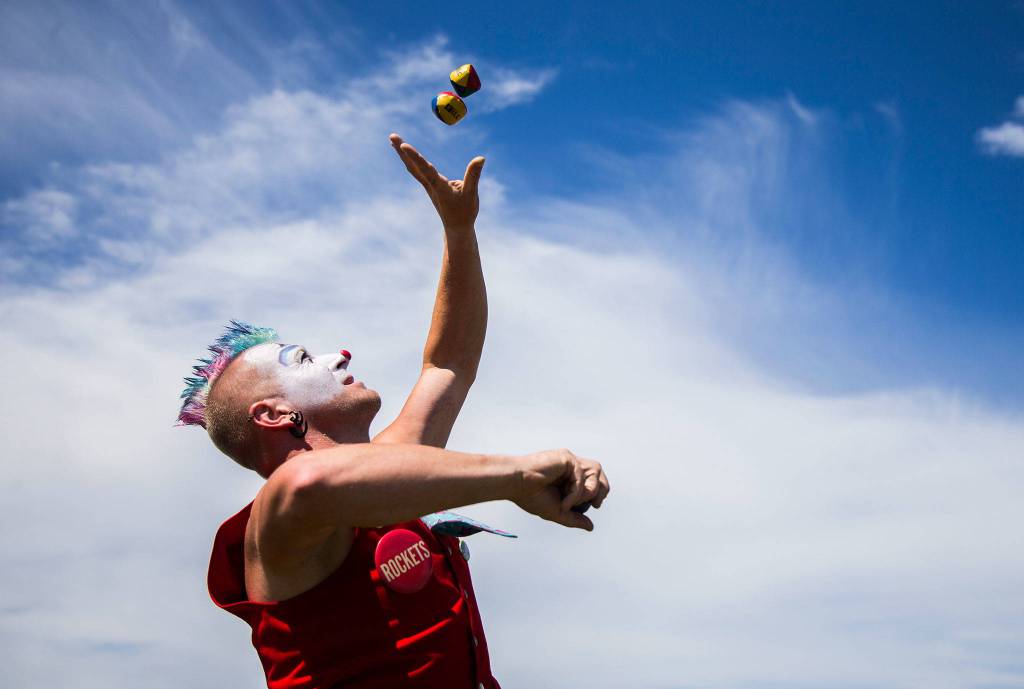 Zak Grenier practices his juggling during Kla Ha Ya Days on Saturday, July 21, 2018 in Snohomish, Wa. (Olivia Vanni / The Herald)