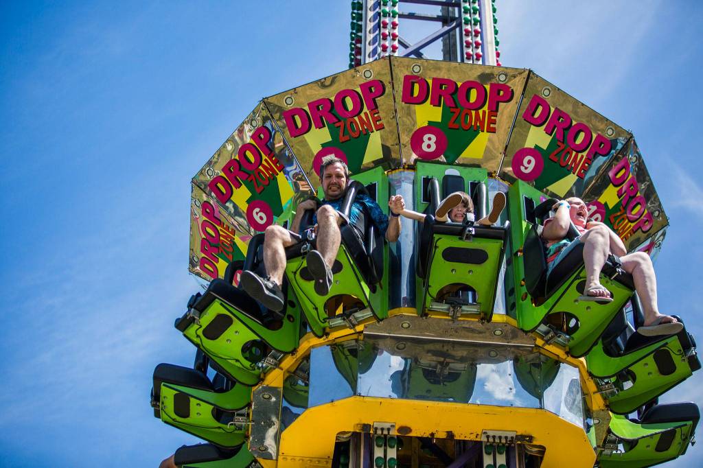 People ride the Drop Zone during Kla Ha Ya Days on Saturday, July 21, 2018 in Snohomish, Wa. (Olivia Vanni / The Herald)