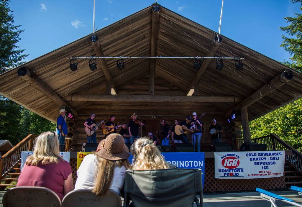 People watch as the Wheres Norm? group comes on stage for open mic during the Darrington Bluegrass Festival on Saturday, July 21, 2018 in Darrington, Wa. (Olivia Vanni / The Herald)