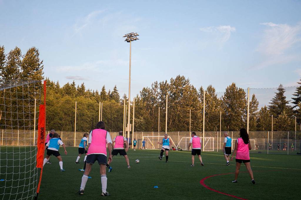 A walk soccer demonstration game is played July 18 at Kasch Park in Everett. (Kevin Clark / The Herald)