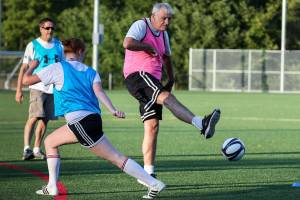 Bob Cole (right) attempts a shot with Kaari Skaugrud defending Wednesday afternoon at Kasch Park in Everett on July 18, 2018. (Kevin Clark / The Herald)