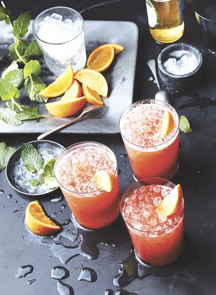 Strawberry-rum coolers are made with lime juice, orange bitters, agave syrup and ginger beer. (Photo by Greg DuPree)