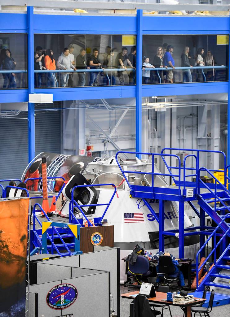 Visitors watch Chris Ferguson train at Johnson Space Center in Houston. (Jonathan Newton/Washington Post)