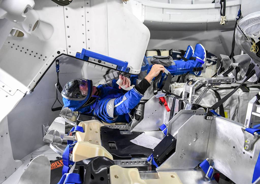Astronaut Chris Ferguson practices as he prepares for flight in the Boeing (CST)-100 Starliner spacecraft mock-up trainer at NASAs Johnson Space Center in Houston. (Jonathan Newton/Washington Post)