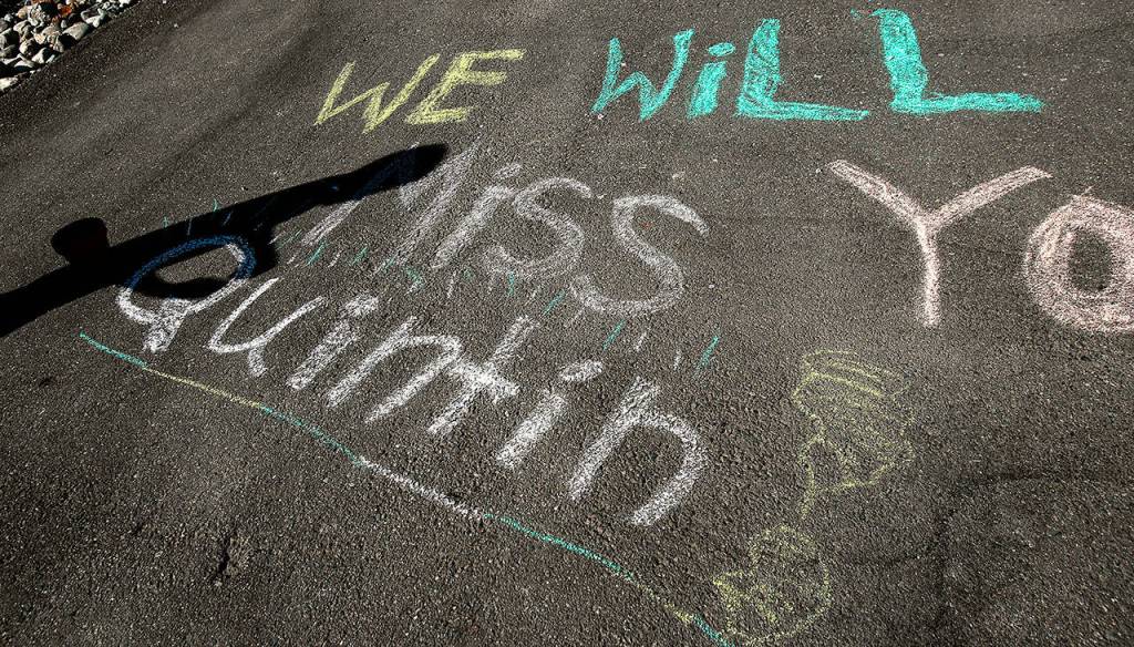 The Marquart and McGowan kids left a message for Quintin Hall on the driveway. (Dan Bates / The Herald)
