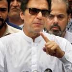 Pakistani politician Imran Khan, chief of Pakistan Tehreek-e-Insaf party, speaks to media after casting his vote at a polling station for the parliamentary elections in Islamabad, Pakistan, on Wednesday. (AP Photo/Anjum Naveed)