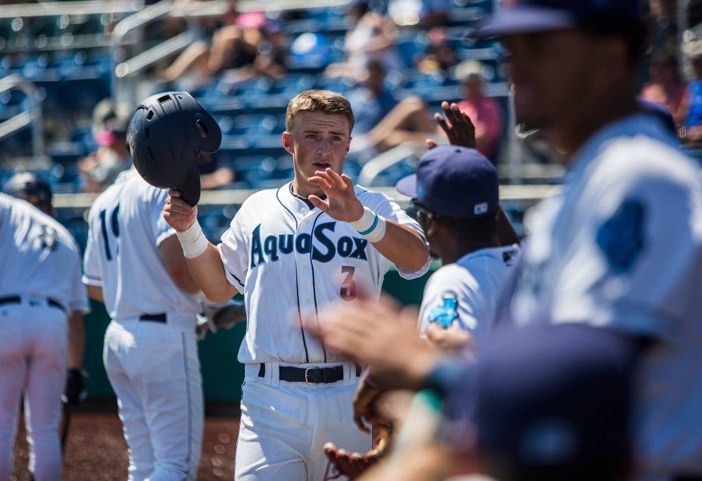Aquasoxs Bobby Honeyman high fives his teammates after scoring during the game against Vancouver at Everett Memorial Stadium on Thursday, July 26, 2018 in Everett, Wa. (Olivia Vanni / The Herald)