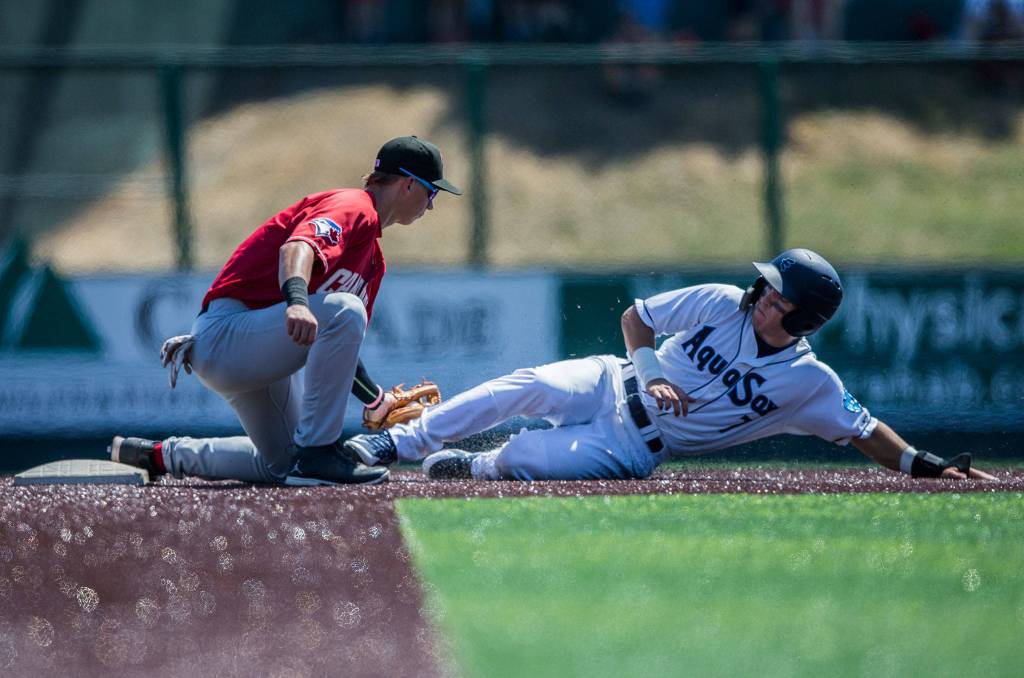 Aquasoxs Ryan Ramiz slides into second and is tagged out by Vancouvers Nick Podkul during the game at Everett Memorial Stadium on Thursday, July 26, 2018 in Everett, Wa. (Olivia Vanni / The Herald)