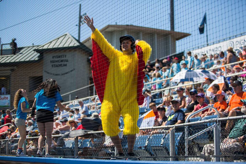 A man dressed in a chicken suit entertains the crowd during the game against Vancouver at Everett Memorial Stadium on Thursday, July 26, 2018 in Everett, Wa. (Olivia Vanni / The Herald)
