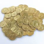 This 5½-inch wide pile of coins is a paperweight, probably first made in the 1960s. It was a popular gift for good customers and executives who were in financial businesses. Some are being sold online for about $40 to $50. (Cowles Syndicate Inc.)