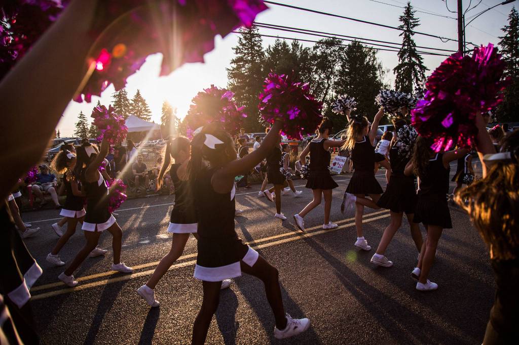 The Pink Zebras cheer team cheers during the Tour de Terrace parade on Friday, July 27, 2018 in Mountlake Terrace, Wa. (Olivia Vanni / The Herald)
