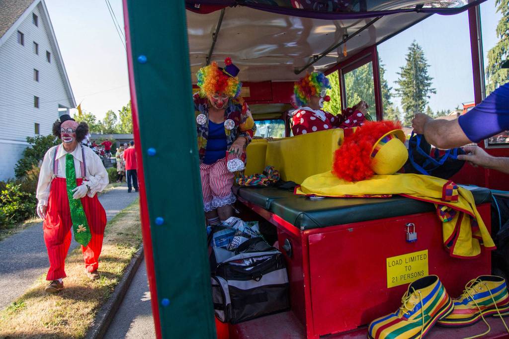 Shriner clowns get ready before the start of the Tour de Terrace parade on Friday, July 27, 2018 in Mountlake Terrace, Wa. (Olivia Vanni / The Herald)
