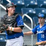 Everetts Marcus McCannel reacts after making a tag at home plate during the Merchants July 28 game against the Seattle Cheney Studs at Everett Memorial Stadium. (Kevin Clark / The Herald)