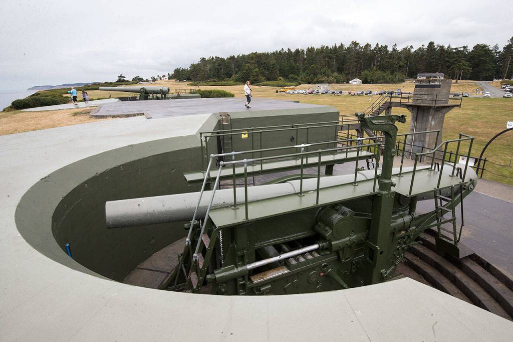 Visitors at Fort Casey State Park in Coupeville walk around the guns, the only 10-inch disappearing guns in the United States and two of four left in the world. An Aug. 11 event at the park will celebrate the 50th anniversary of the guns that are the same models as the originals. (Andy Bronson / The Herald)