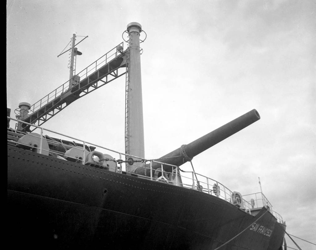 During the passage from the Philippines to Washington, a freak storm at sea caused the cargo ship San Francisco to roll 40 degrees. One of the gun barrels broke loose, flew across the deck and wound up dangling over the side of the ship. It arrived safely in Bremerton in June 1968. (Washington State Parks Collection)
