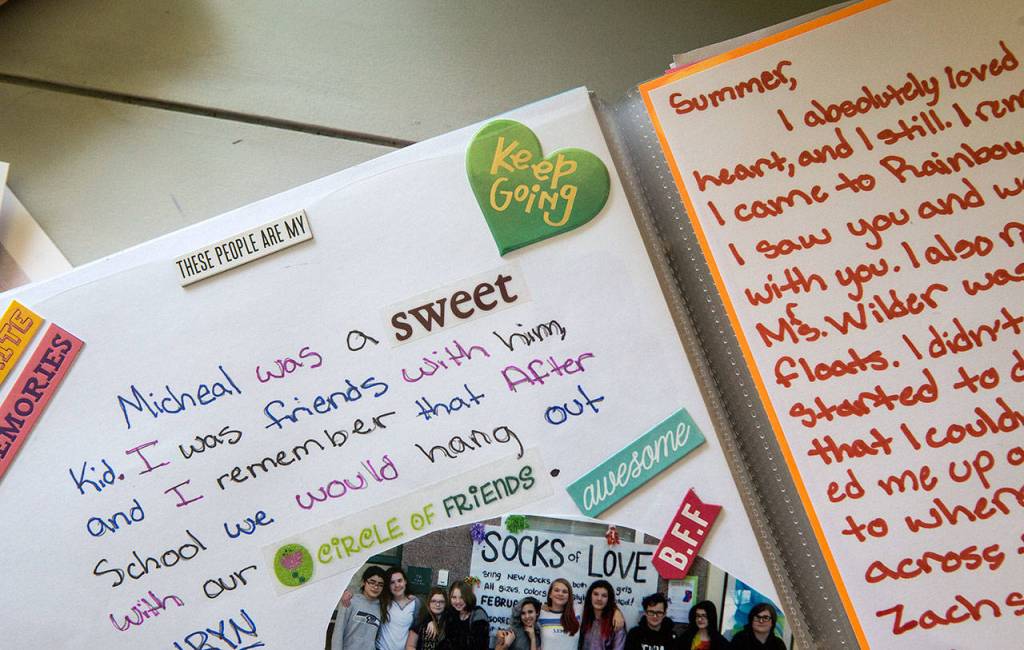 A scrapbook preserves memories, notes, photographs and drawings from friends of Summer, who also went by Michael. They tell of a young person who stood up for her friends and made them laugh. Her grandmother keeps the scrapbook. (Andy Bronson / The Herald)
