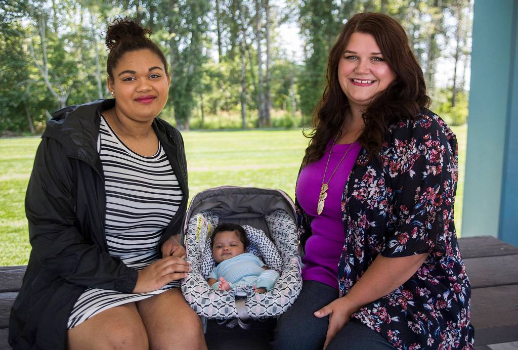 Olivia Vanni / The Herald                                 Abigail Hulce, 19 (left), with daughter Kya Lankford, 2 months, and PEPS group leader Holly McCallum at Lundeen Park in Lake Stevens. on July 27.