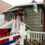 The Everett Recovery Cafes leased building at 2212 Broadway in Everett is for sale. The growing nonprofit is moving into the lower level of the old Everett Public Market building. A sign outside the Broadway location says, We are Still Open! (Dan Bates / The Herald)