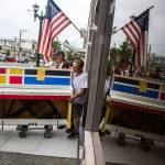 Robert Alkire (left), Michael Alkire and Dan DeMascio of Piano and Organ Moving Co. Inc. move the Broadway Boogie Woogie piano into their moving van on Aug. 1 for Everetts Street Tunes. (Olivia Vanni / The Herald)